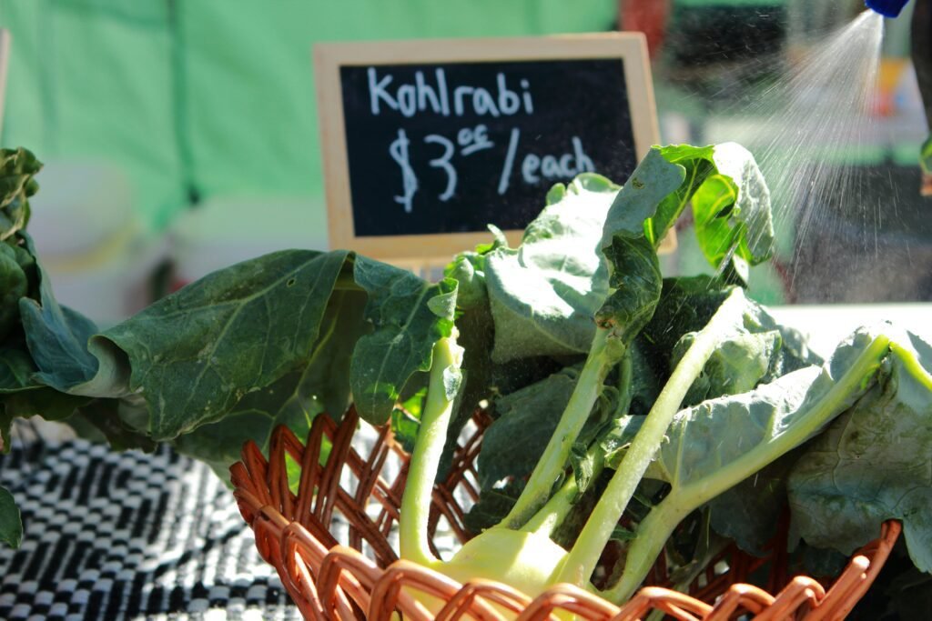 A basket filled with lots of green vegetables