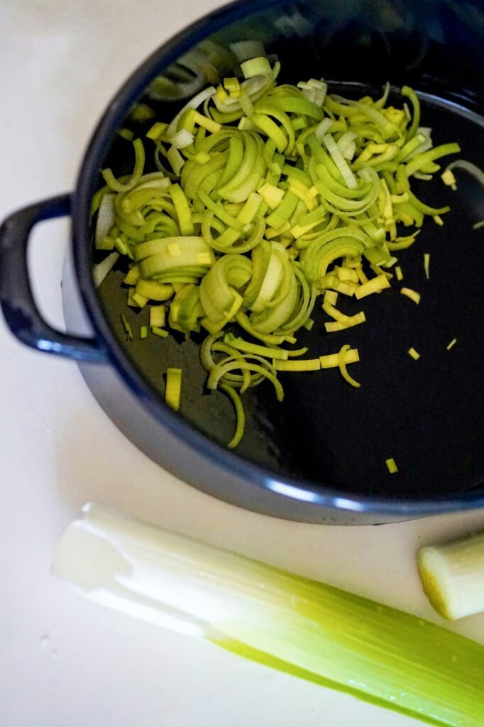 green vegetable on black cooking pan green vegetable on black cooking pan