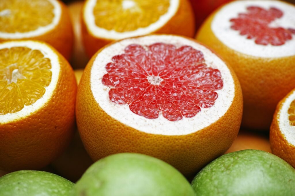 orange fruit on green fruit orange fruit on green fruit