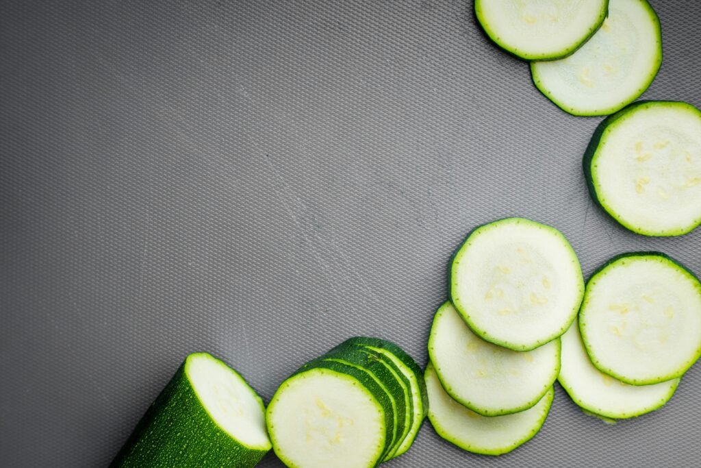 sliced cucumber on gray textile sliced cucumber on gray textile